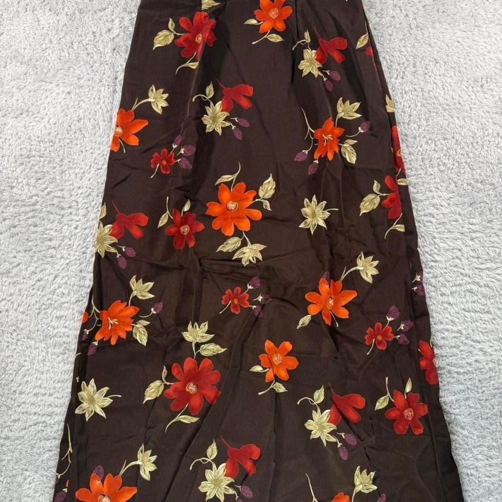 Brown floral maxi skirt with button-up front and elastic waistband.